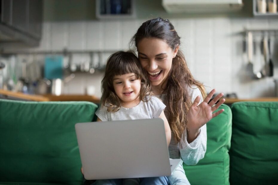 Women and Child wave to laptop