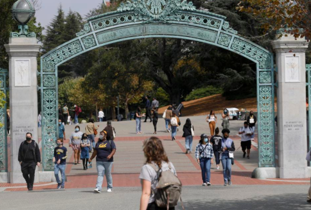 : Students walk near the Sather Gate on the UC Berkeley campus in Berkeley, Calif