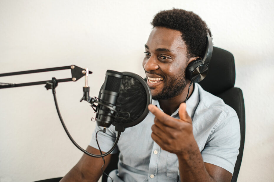 Man podcasting behind a mic