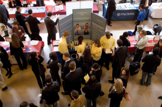 NEW BRUNSWICK, NJ - JANUARY 4: Students, graduates and adults seeking job opportunities gather around tables of corporations and government offices during a job fair at Rutgers University on January 4, 2006 in New Brunswick, New Jersey. Over 230 corporations registered for the annual state wide New Jersey Career Day. Nearly 2500 students and professionals seeking full-time entry-level positions and internship possibilities participated. Many of the attending corporations will make at least one hire from the Rutgers job fair following secondary and follow-up interviews. (Photo by Robert Nickelsberg/Getty Images)