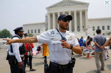 WASHINGTON, DC - JUNE 29: Police officers with the U.S. Supreme Court clear people from the sidewalk in front of the U.S. Supreme Court Building after alerts of a suspicious package on June 29, 2023 in Washington, DC. In a 6-3 vote, Supreme Court Justices ruled that race-conscious admissions programs at Harvard and the University of North Carolina are unconstitutional, setting precedent for affirmative action in other universities and colleges. (Photo by Anna Moneymaker/Getty Images)GETTY IMAGES